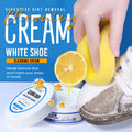 White shoe cleaning cream with sponge removing dirt from a white sneaker