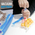 Hand pump removing air from a reusable vacuum bag